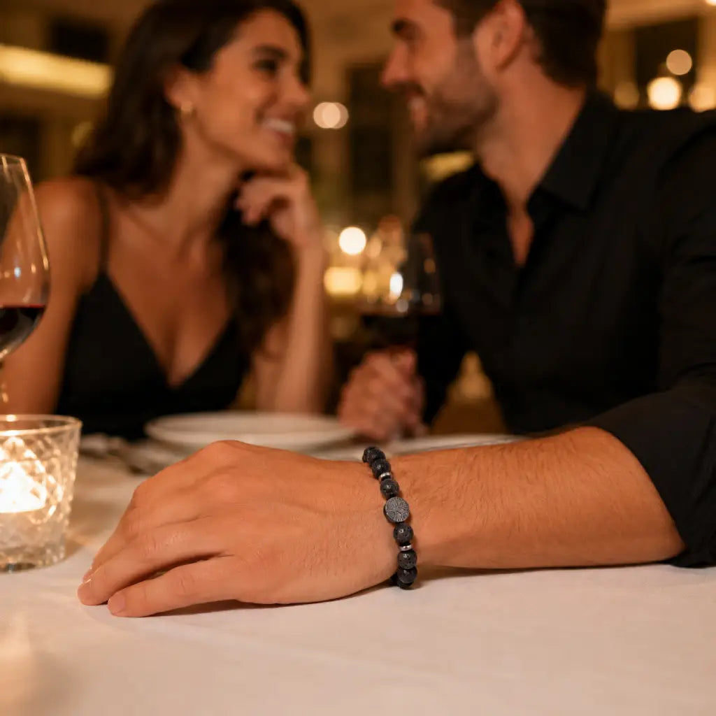 Lava stone bracelet worn during romantic dinner featuring natural volcanic beads for elevated modern style.