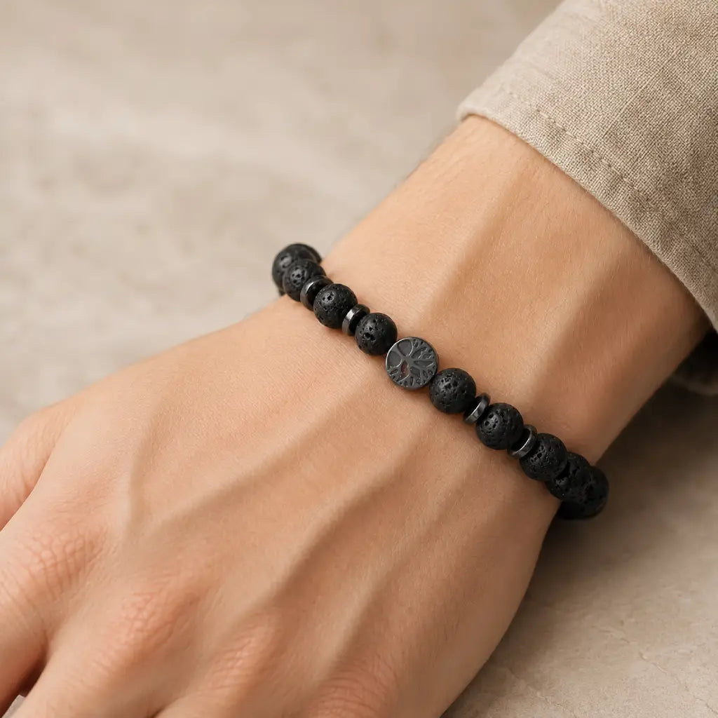 Lava stone bracelet on wrist with sleek volcanic bead design for modern everyday fashion versatility.