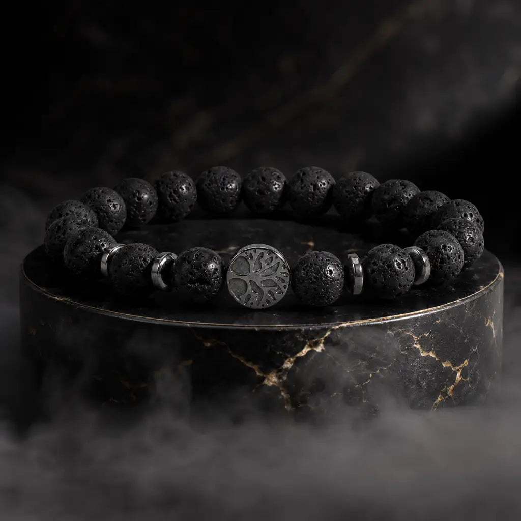 Lava stone bracelet on black marble display highlighting volcanic bead texture for bold luxury styling.