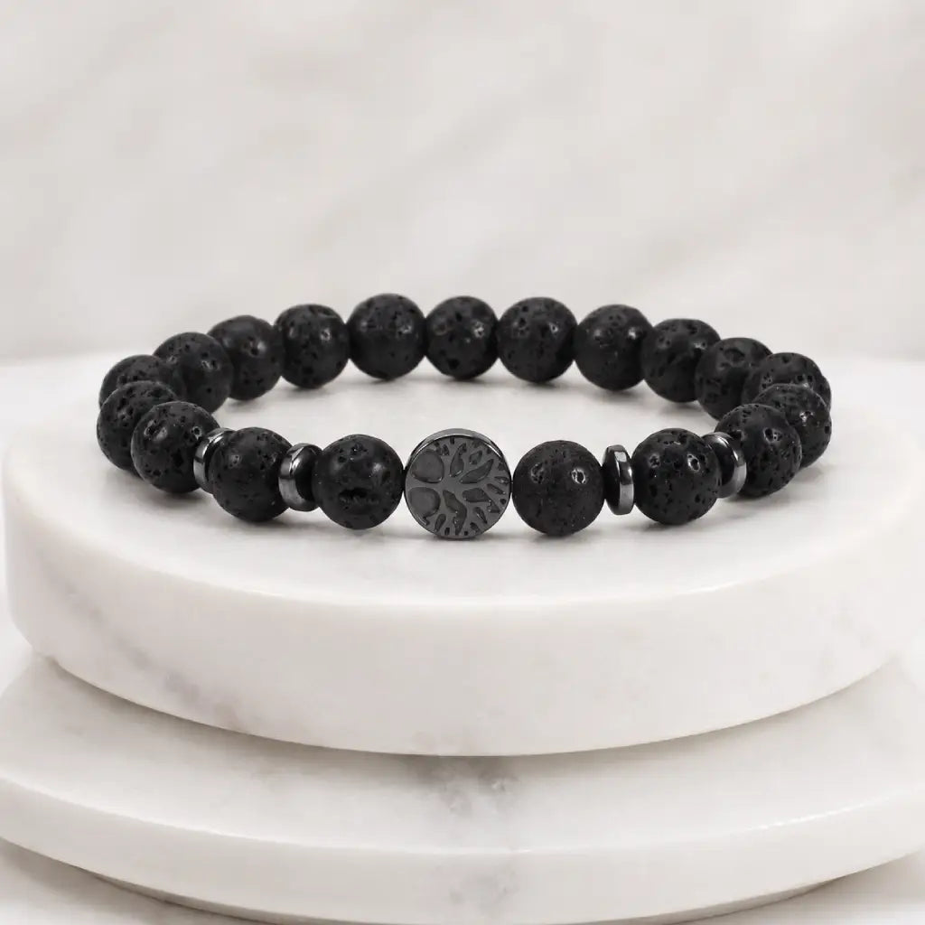 Lava stone bracelet displayed on marble stand with volcanic bead details for premium jewelry presentation.