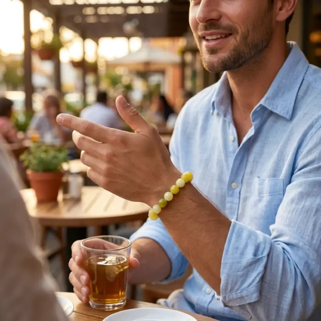 Lemon jade bracelet styled on wrist at cafe with polished beads, modern gemstone jewelry for casual daily outfits

