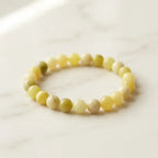 Lemon jade bracelet in clean product view with pale green beads, polished gemstone style for mindful gifting
