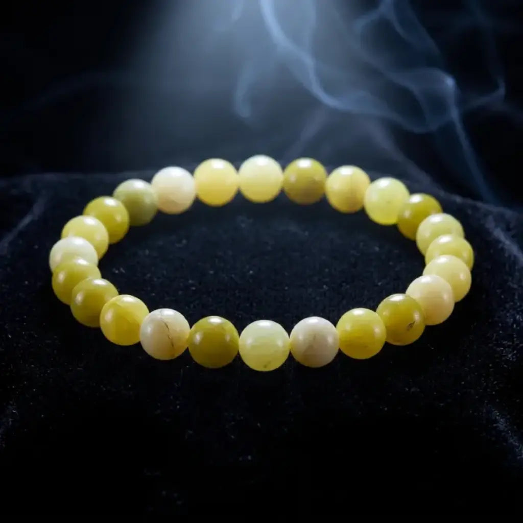Lemon jade bracelet on black velvet with soft smoke effect, luxury gemstone jewelry for high end visual appeal
