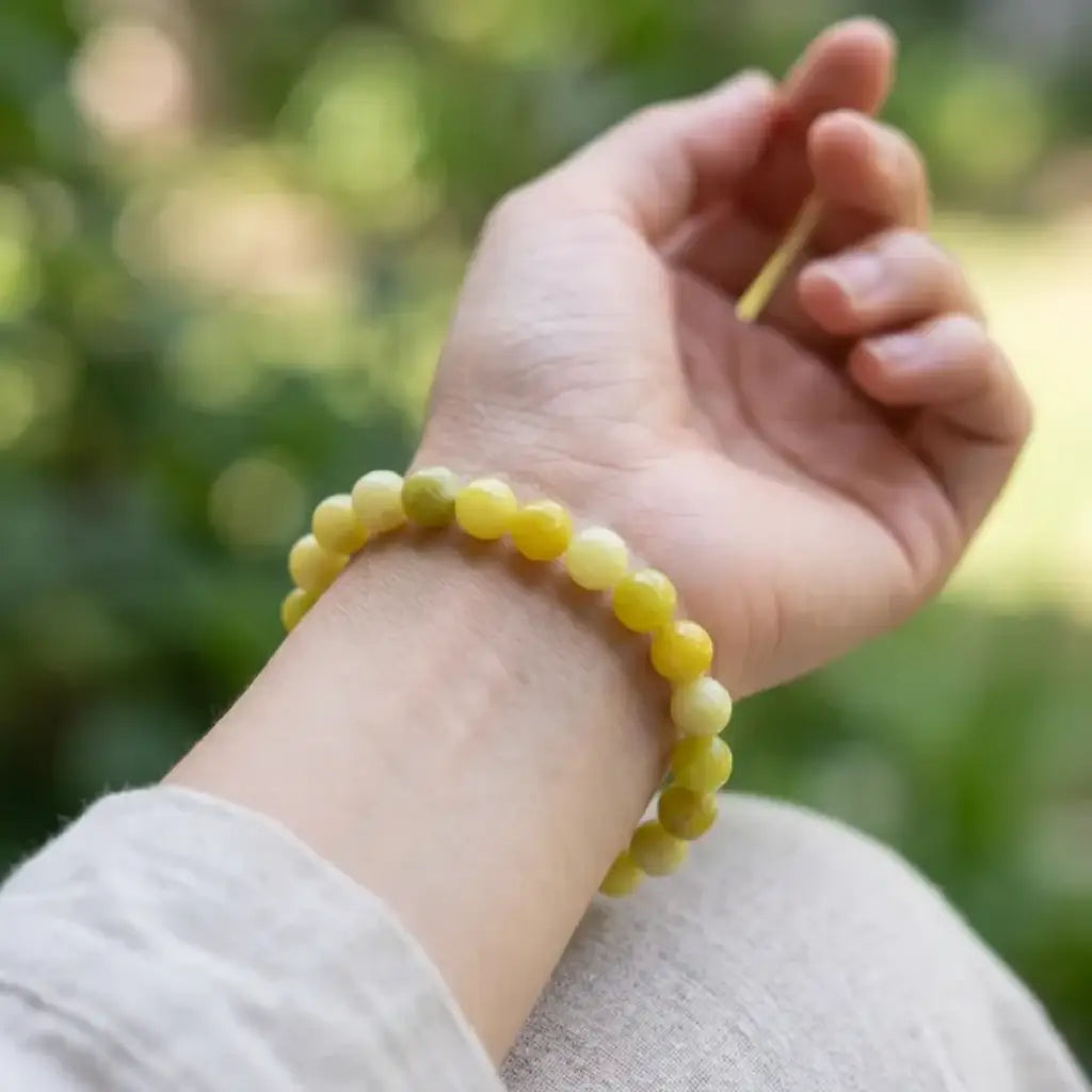 Lemon jade bracelet worn on wrist outdoors with bright beads, natural stone jewelry for everyday wear comfort
