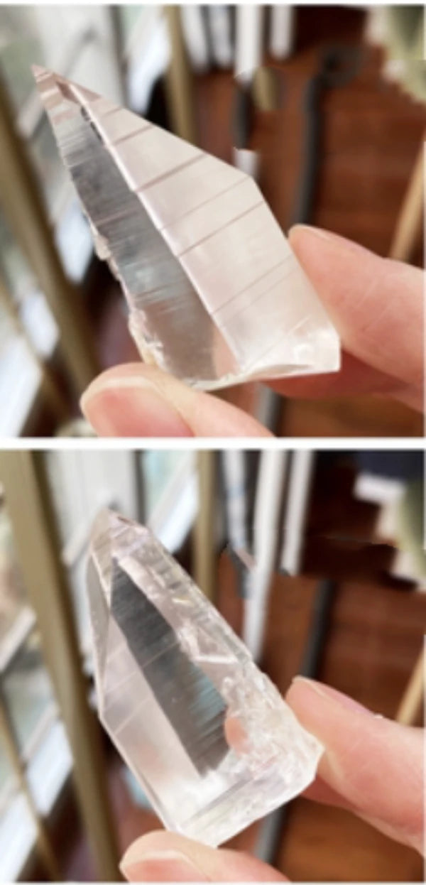 Lemurian etched crystal point featuring signature horizontal growth lines and exceptional clarity, a beautiful quartz specimen for display.