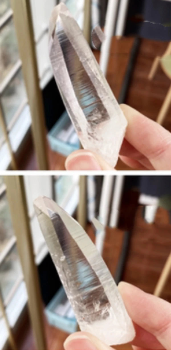 Lemurian healing crystal point with polished faces and natural frosted base, an elegant quartz specimen for collectors and display.