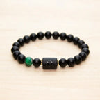 Leo zodiac bracelet featuring black beads and green gemstone accent, elegant handcrafted jewelry for bold stylish expression