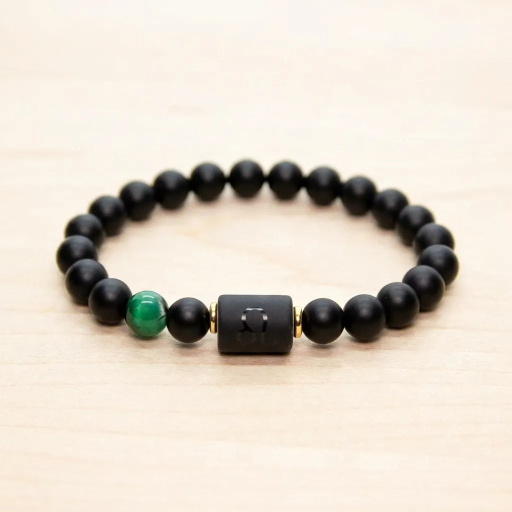 Leo zodiac bracelet featuring black beads and green gemstone accent, elegant handcrafted jewelry for bold stylish expression