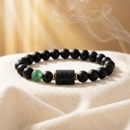 Leo zodiac bracelet with black beads and green gemstone, aesthetic astrology jewelry for stylish confident daily wear