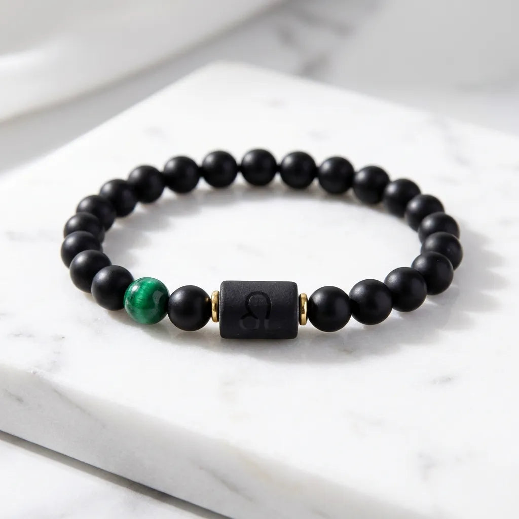 Leo zodiac bracelet with black beads and vibrant green gemstone, modern astrology accessory for bold personality and style
