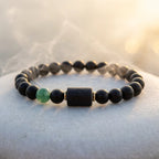 Leo zodiac bracelet featuring matte black beads and green accent, minimalist astrology jewelry for modern confident style