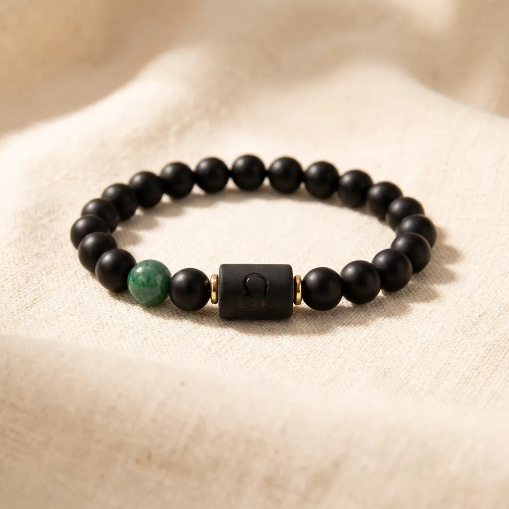 Leo zodiac bracelet with matte black beads and green stone, timeless astrology jewelry symbolizing strength and confidence