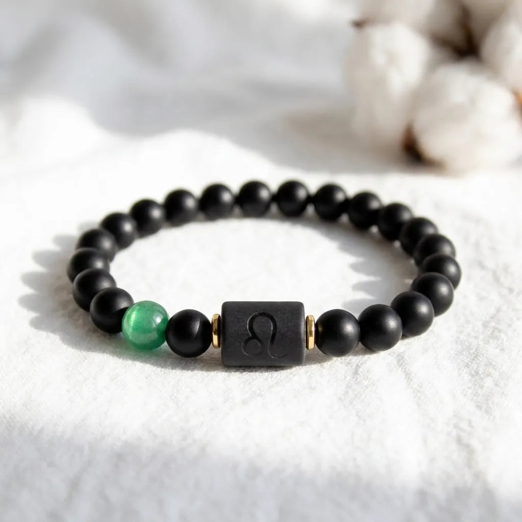 Leo zodiac bracelet with polished black beads and green stone, luxury astrology jewelry symbolizing strength and personal power