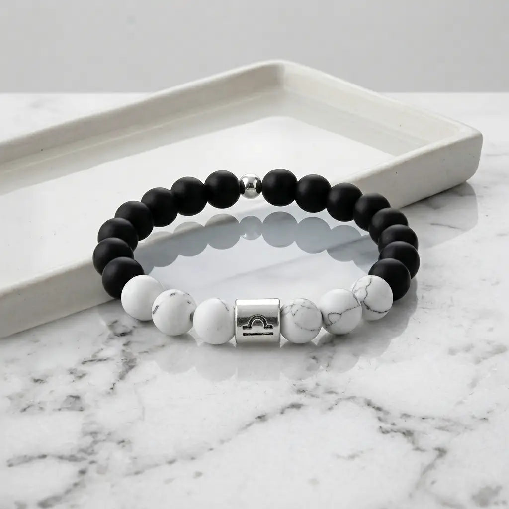 Black and white beaded bracelet on a marble surface