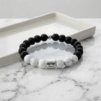 Black and white beaded bracelet on a marble surface
