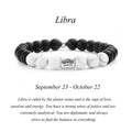 Libra zodiac bracelet with matte black Agate and white Howlite beads and a silver Libra scales charm on white background
