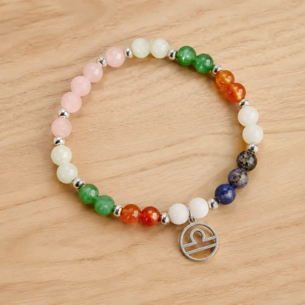 Libra zodiac Jewelry bracelet with colorful gemstones and silver Libra charm displayed on natural wood background