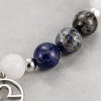 Libra zodiac Jewelry showcasing lapis lazuli and speckled gemstone beads with silver accents for celestial elegance