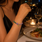 Lotus bracelet featuring gemstone bead details in candlelight creating elegant spiritual fashion appeal