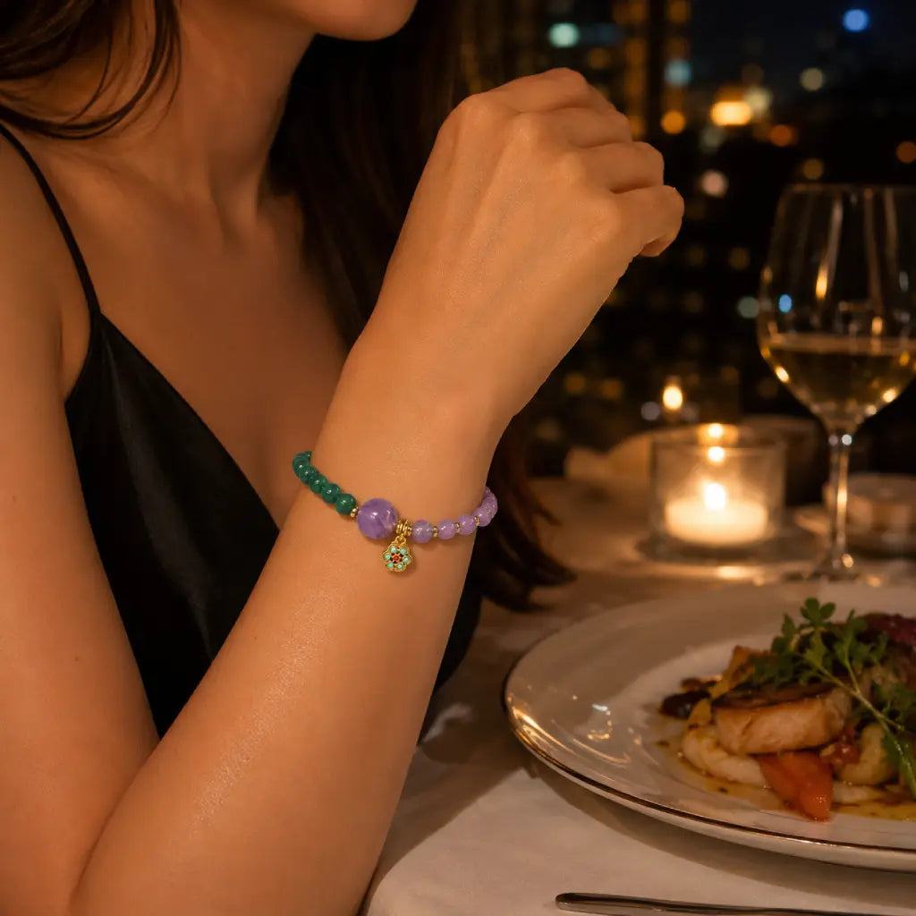 Lotus bracelet featuring gemstone bead details in candlelight creating elegant spiritual fashion appeal