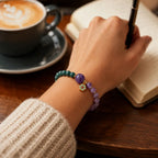 Lotus bracelet with purple gemstone accents worn during journaling for calm energy and daily inspiration
