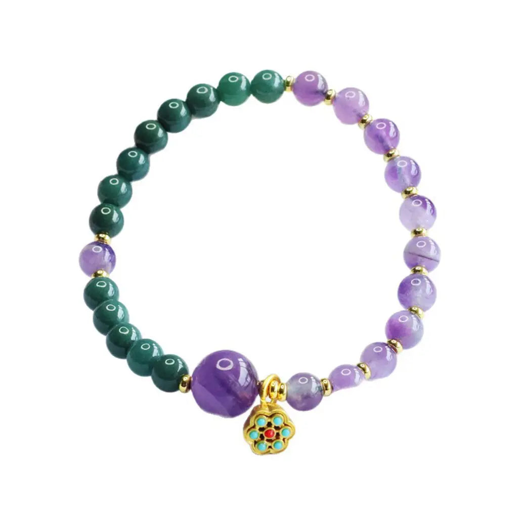 Lotus bracelet featuring purple and green crystal beads with elegant healing jewelry inspired design