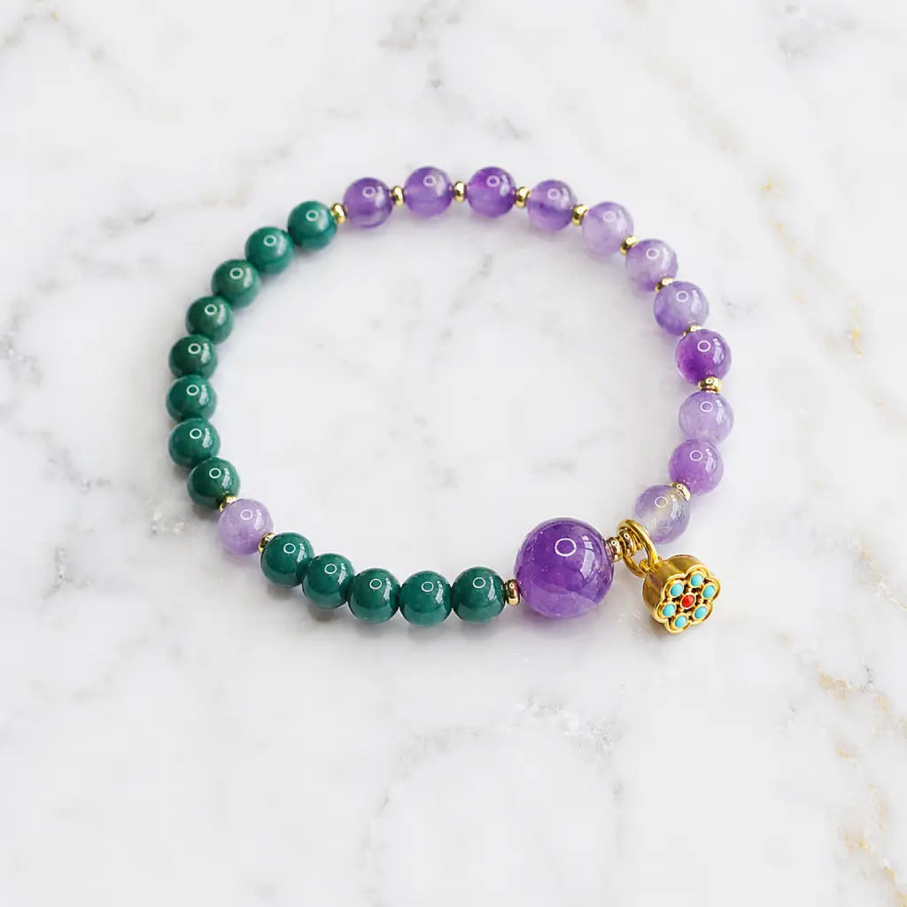 Lotus bracelet with green gemstone and amethyst crystal beads designed for elegant spiritual fashion