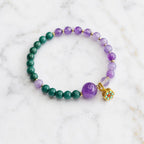 Lotus bracelet with green gemstone and amethyst crystal beads designed for elegant spiritual fashion