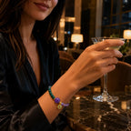 Lotus bracelet with purple and green gemstone beads styled for elegant evening wear and mindful fashion