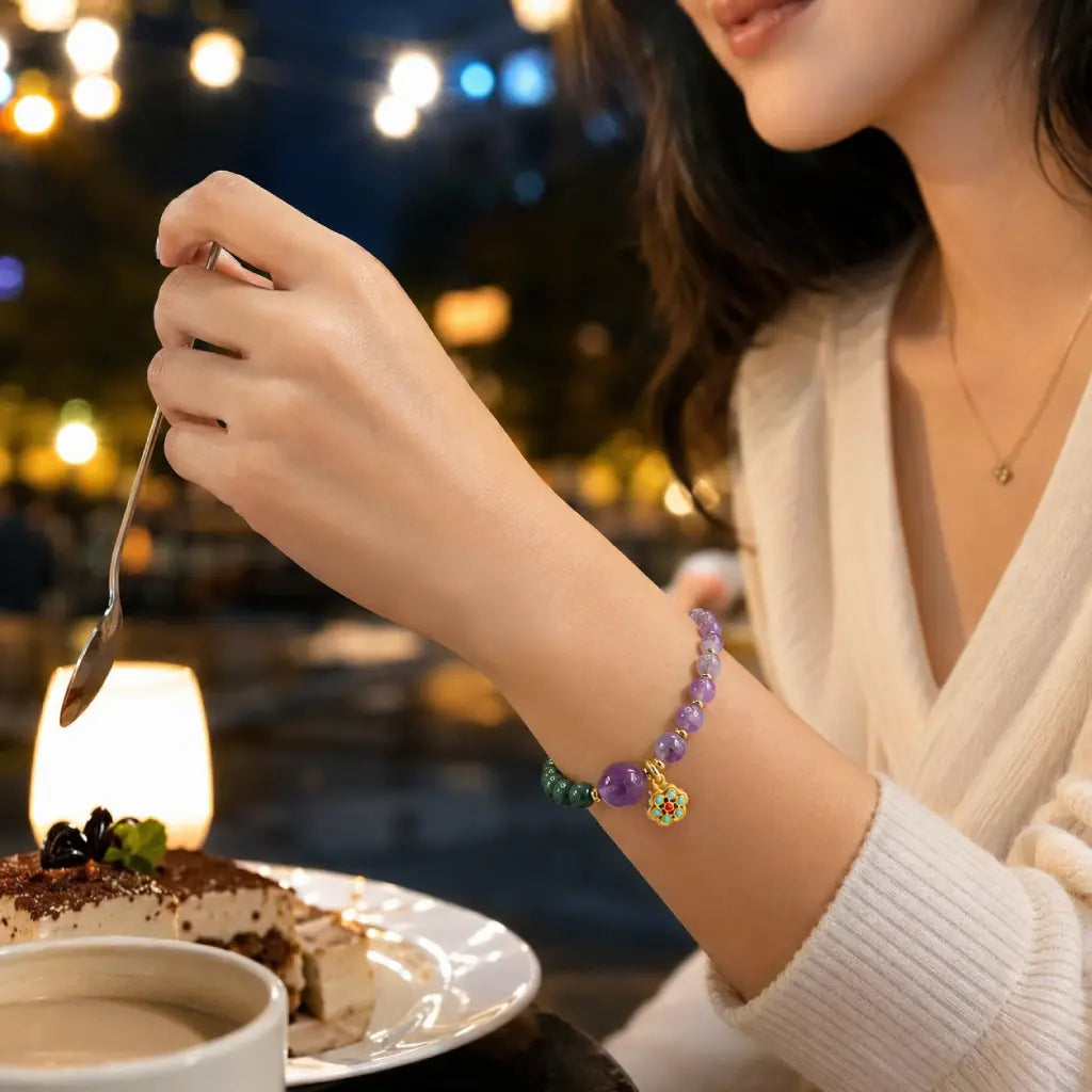 Lotus bracelet worn during cafe dining with gemstone accents for stylish everyday spiritual fashion