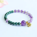 Lotus bracelet with polished gemstone beads and lotus charm designed for peaceful energy and style