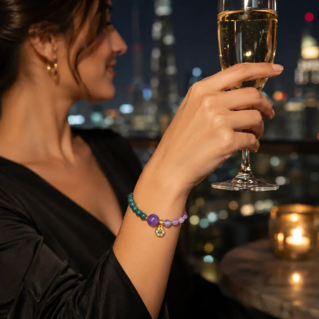 Lotus bracelet with healing crystal beads styled against city lights for modern mindful elegance
