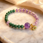 Lotus bracelet with gemstone bead design and floral charm creating peaceful crystal energy style