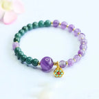 Lotus bracelet showcasing healing crystal gemstones and delicate charm details for everyday wellness fashion