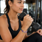 Lotus bracelet with gemstone beads worn during strength training for balanced wellness and active style