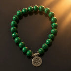 Lotus charm tigereye green gemstone bracelet with striped crystal beads and spiritual lotus pendant design