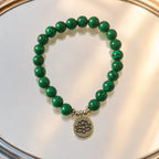 Lotus charm tigereye premium gemstone bracelet with polished green beads for yoga and meditation style