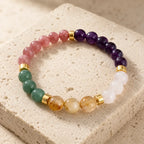 Manifestation bracelet displaying colorful gemstone crystals with wellness energy for peaceful daily focus.