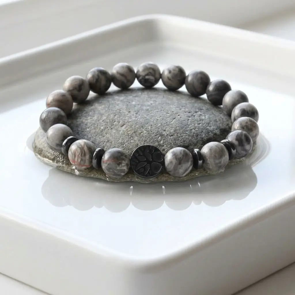 map jasper bracelet displayed on smooth river stone, gray natural beads for grounded mindful everyday wear style