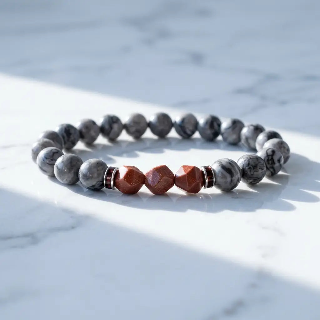 Map stone jasper bracelet on cool white stone with gray marbled beads and red accents for clean gemstone style