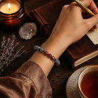 Map stone jasper bracelet worn while journaling with candle, tea, and lavender for soothing ritual style and daily wear