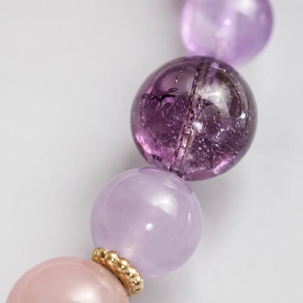 Natural Rose Quartz Amethyst Clear Quartz Crystal bracelet featuring polished amethyst beads and gemstone texture.