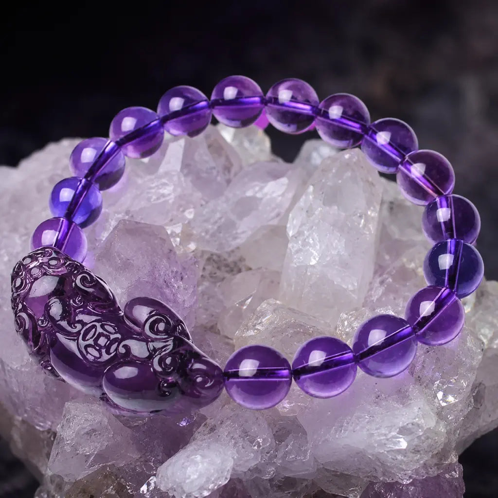 Natural amethyst bracelet with crystal stone backdrop and gemstone beads for healing energy inspiration
