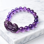 Natural amethyst bracelet on marble display with purple gemstone beads and healing crystal charm for elegance