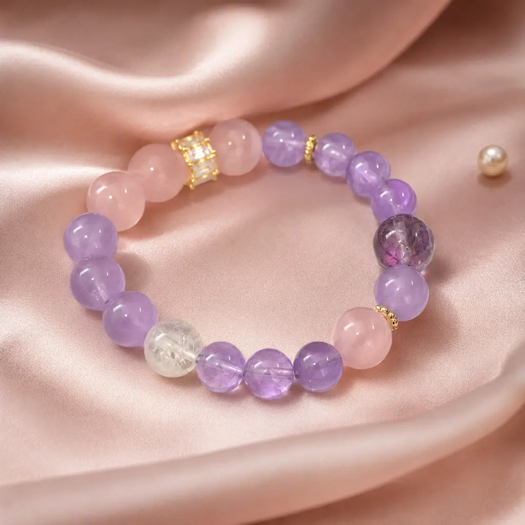 Natural Rose Quartz Amethyst Clear Quartz Crystal bracelet on silk fabric with feminine gemstone luxury design.