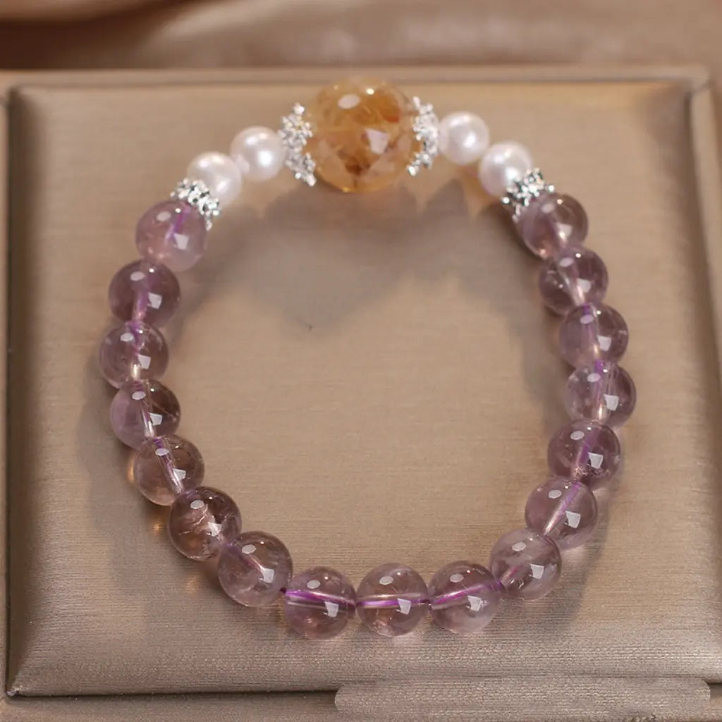 Natural ametrine citrine bracelet featuring polished gemstone beads with elegant pearl details.