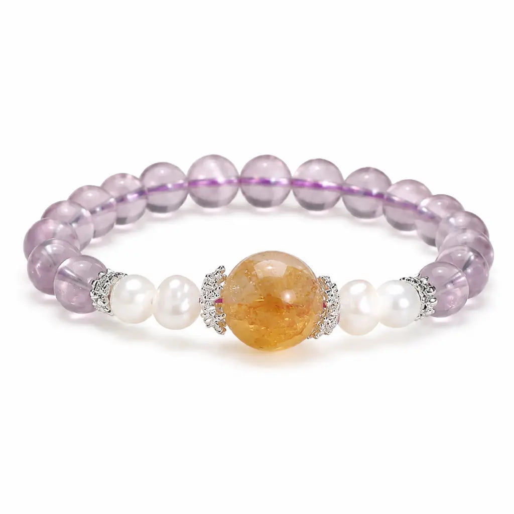Natural ametrine citrine gemstone bracelet with pearl accents and healing crystal beads on clean white background.