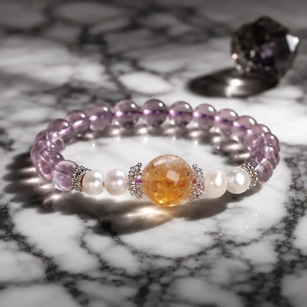 Natural ametrine citrine bracelet with pearl accents and healing crystal beads displayed on elegant marble surface.