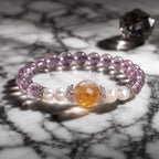 Natural ametrine citrine bracelet with pearl accents and healing crystal beads displayed on elegant marble surface.