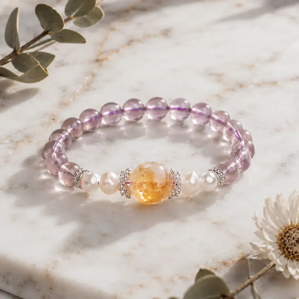 Natural ametrine citrine crystal bracelet styled with floral accents and elegant pearl gemstone details.